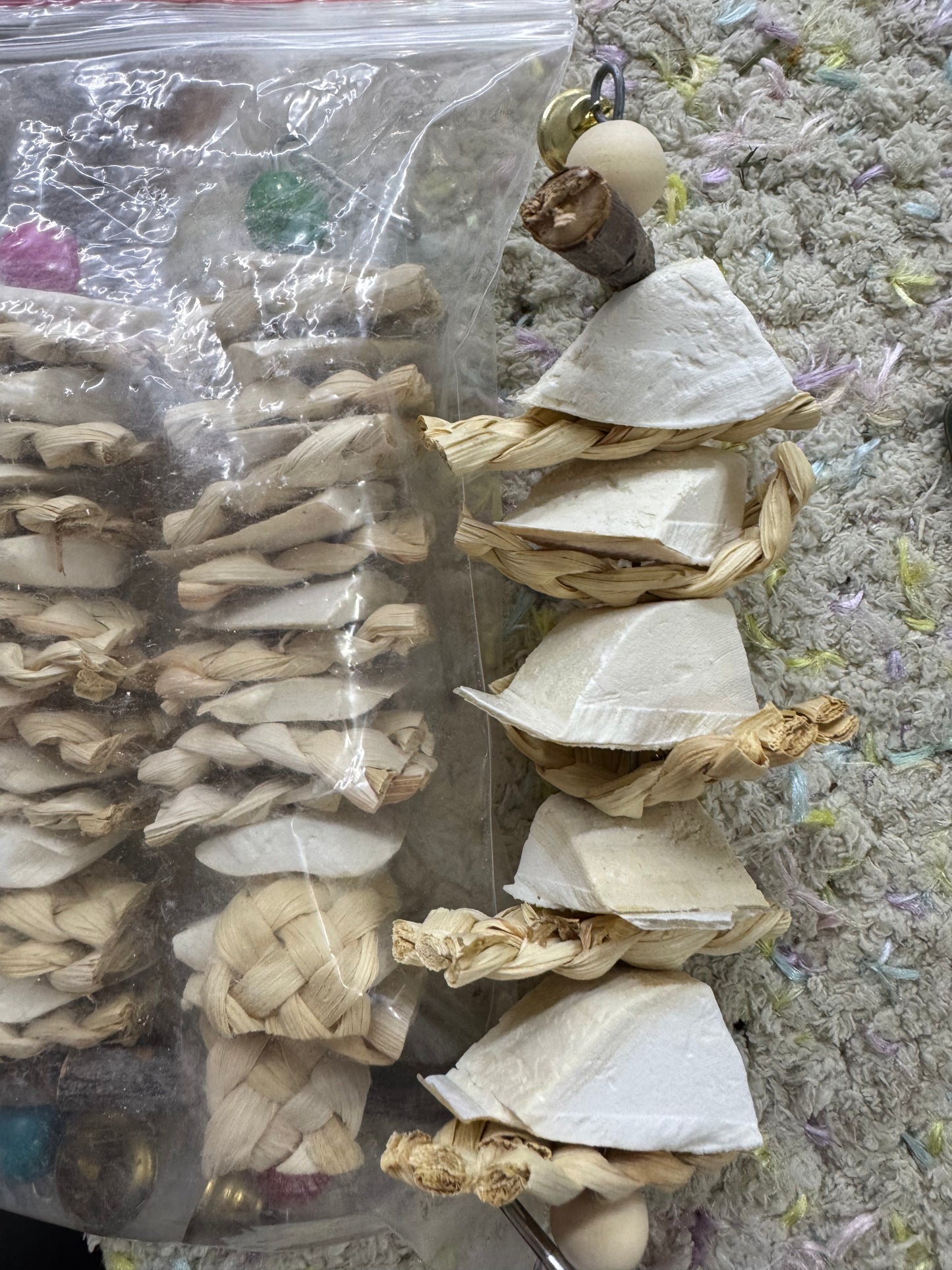 String of cuttlebone with shredders chew toy